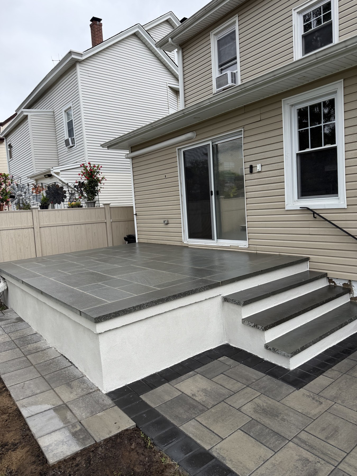 Finished front steps and masonry stoop at a home entrance