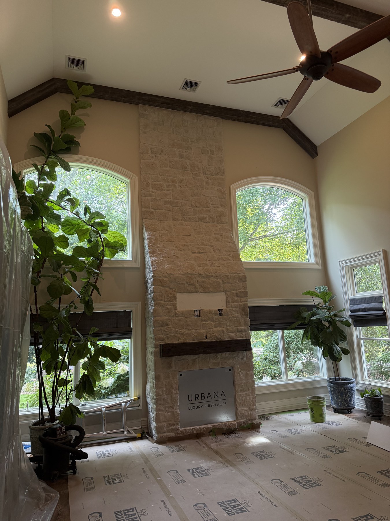 Custom stone fireplace built on a covered patio