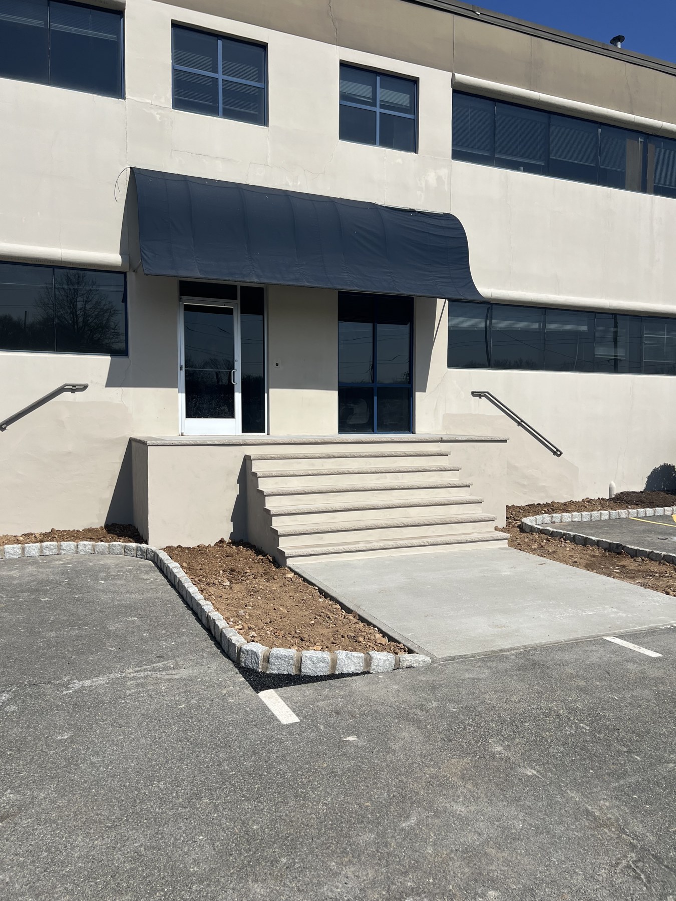 Commercial building entrance with wide masonry steps
