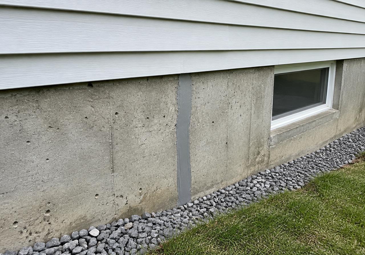 Professionally sealed repair in a concrete house foundation